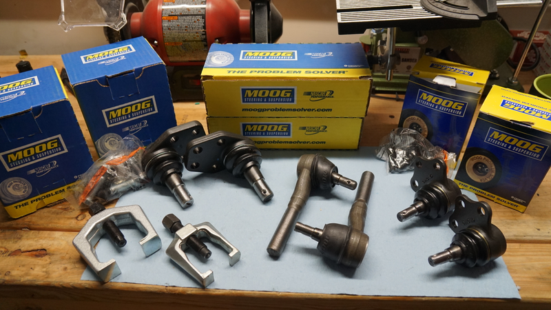 New parts, including some tie rod ends - those will be a later job. Pay no mind to those jaw pullers. They didn’t work so well for this task.